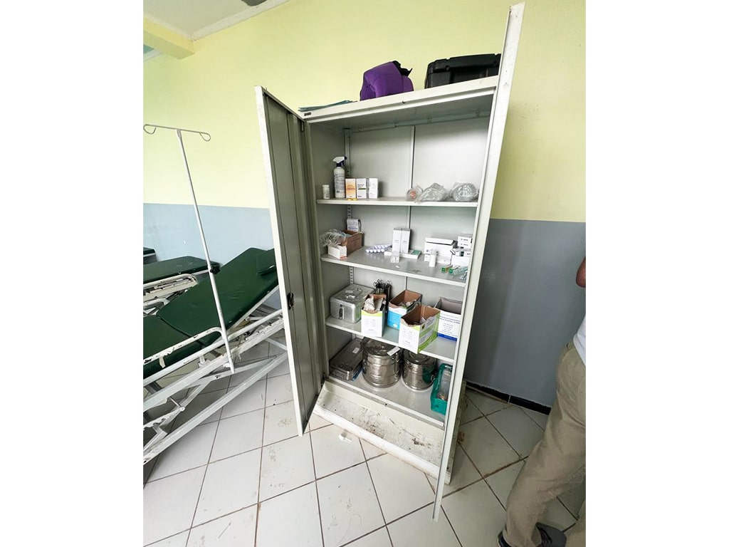 opened cabinet with medical equipment inside