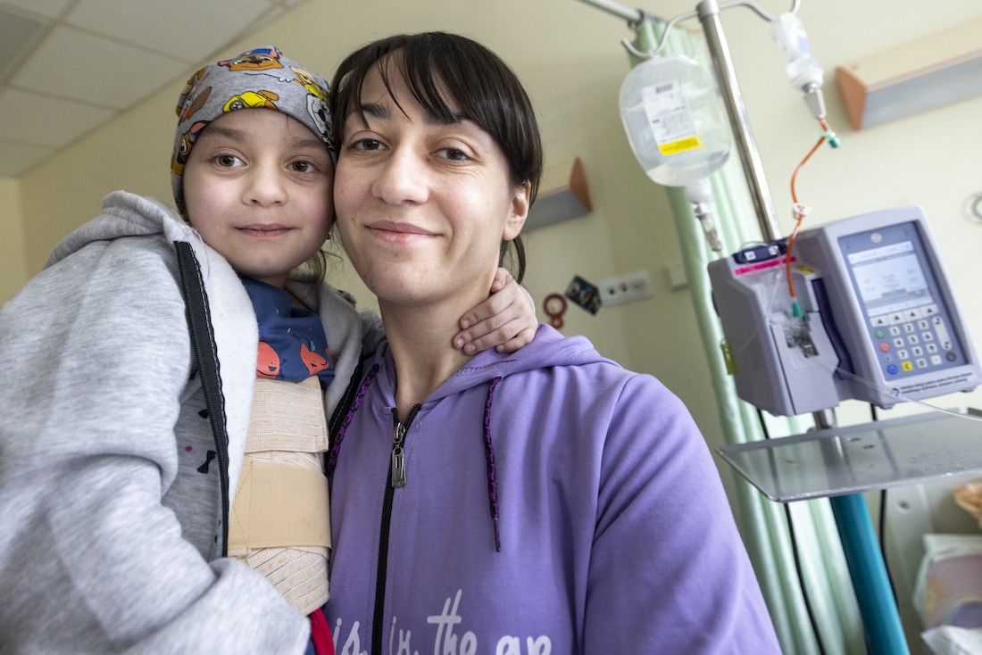 a mother and daughter inside a children's hospital in Poland