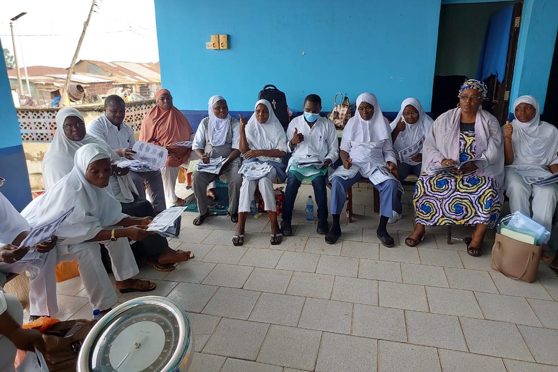 A group of people in Nigeria sitting together.