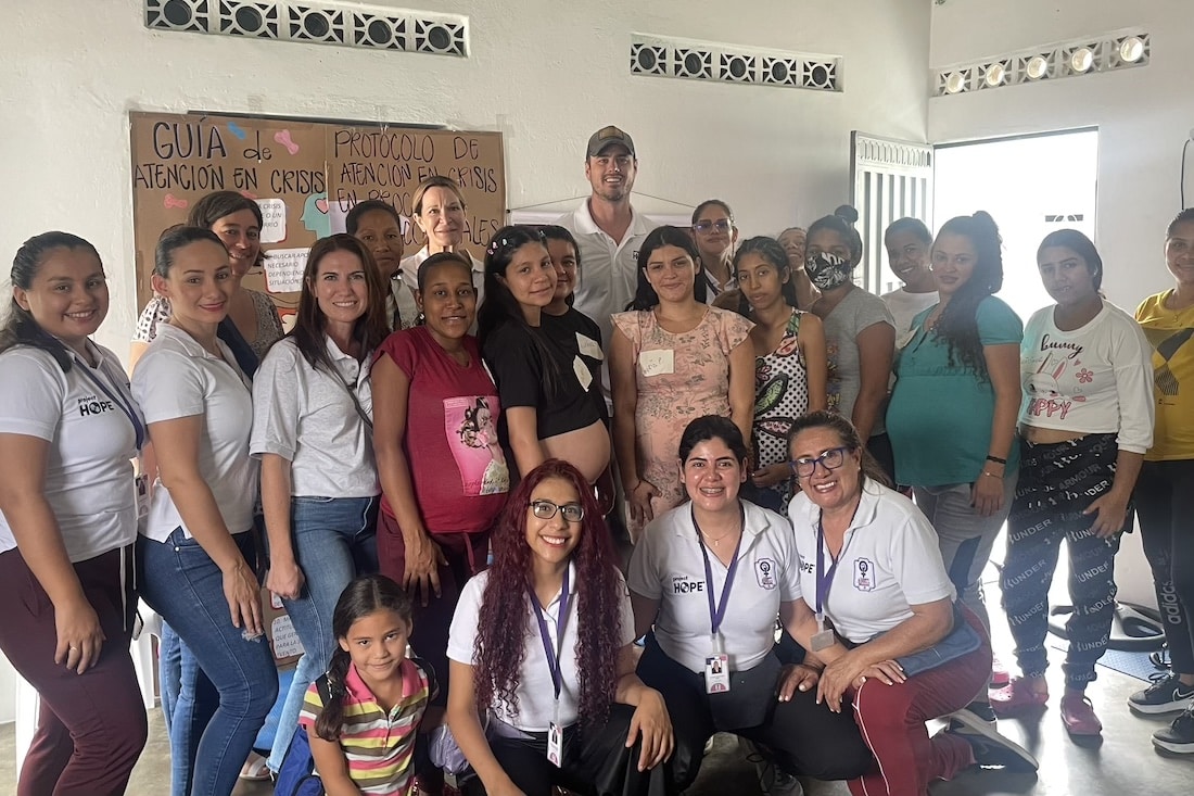 group shot of nurses, doctors, and patients at a hospital in Colombia.