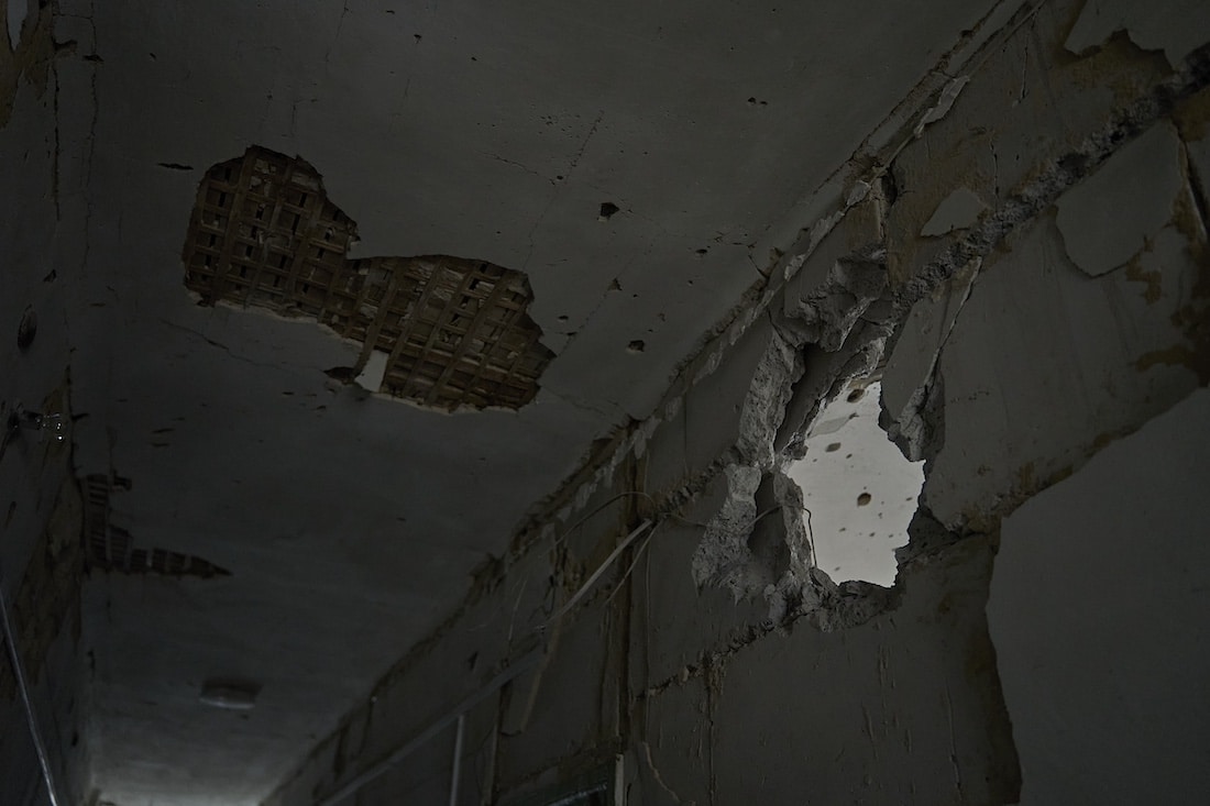 destroyed wall inside of a hospital