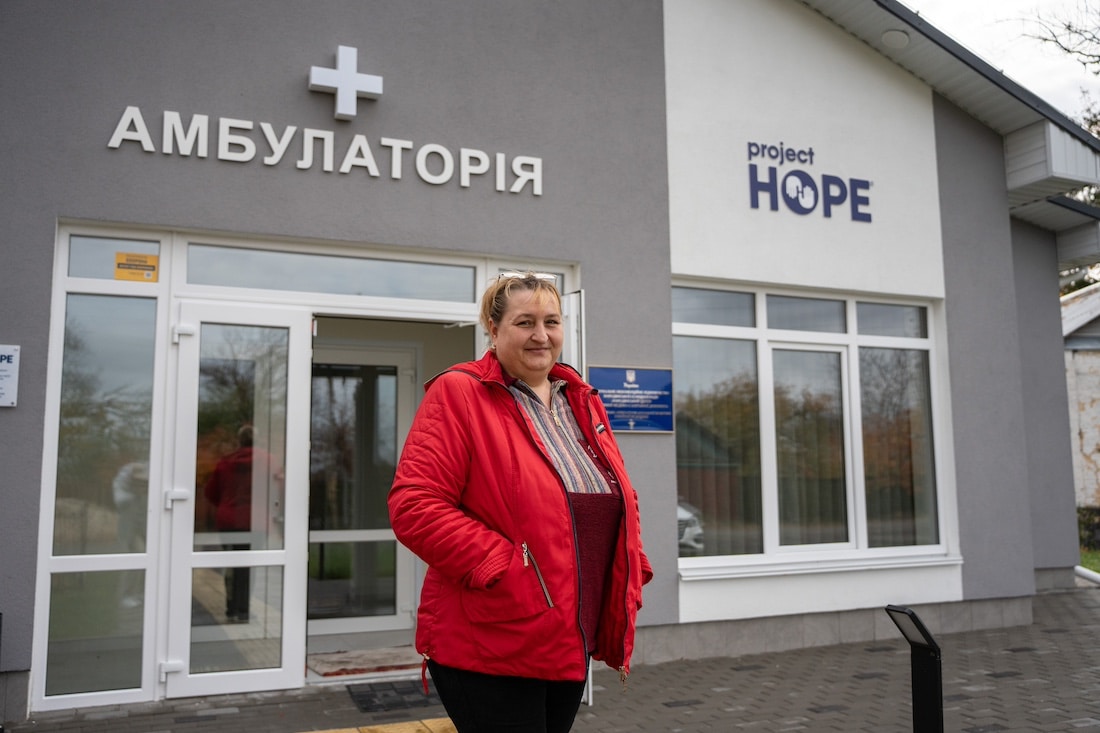 woman standing in front of clinic