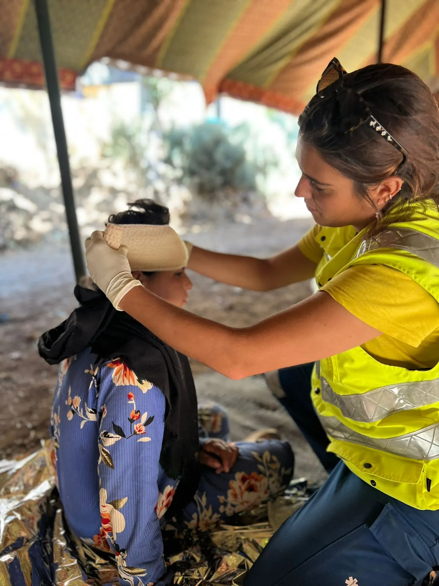 medical staffer wraps the head of a patient in Morocco