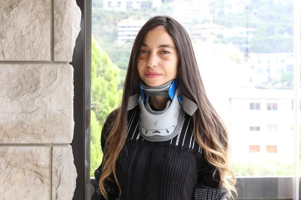 woman injured with neck brace on