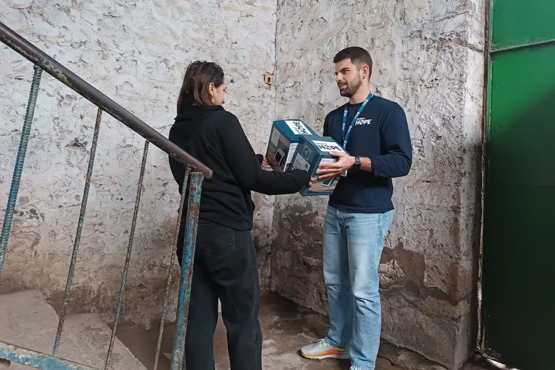 man giving woman a heater