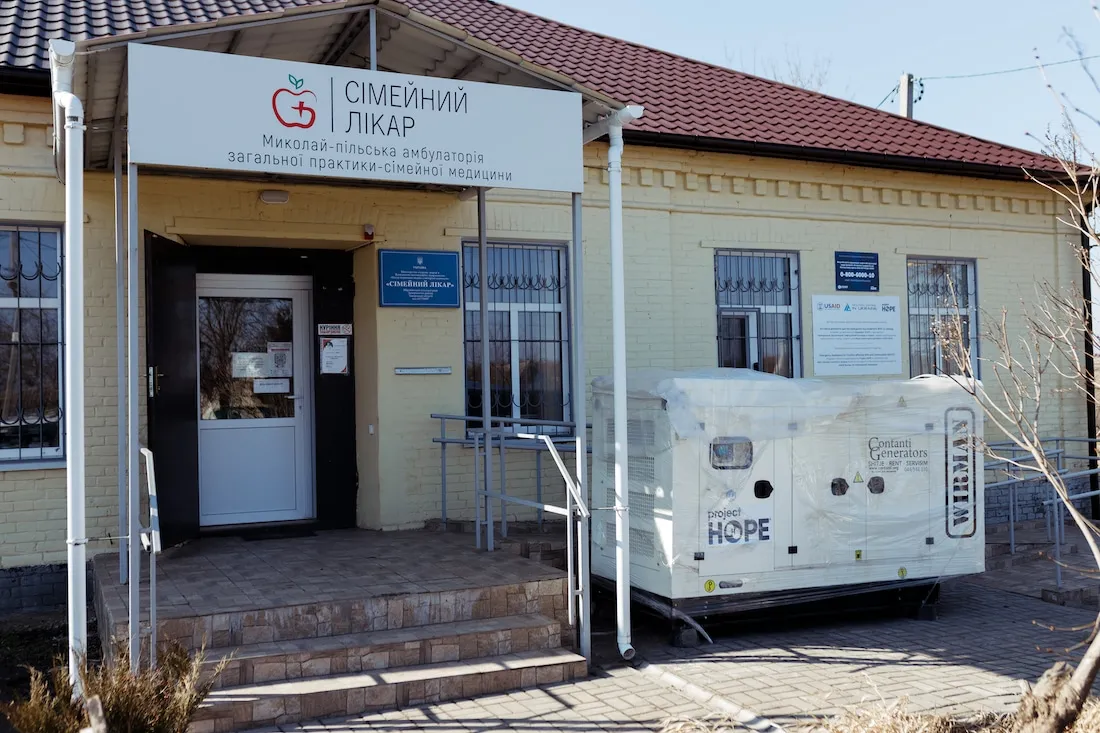 Building in Ukraine with a generator outside of it.