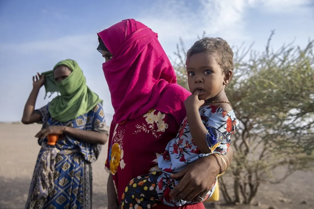 woman holding small child