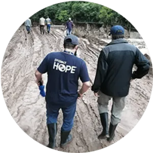 two men walking down a road