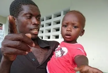 father and child in Haiti