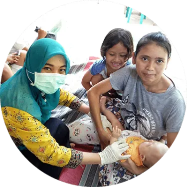 nurse with mother and two children