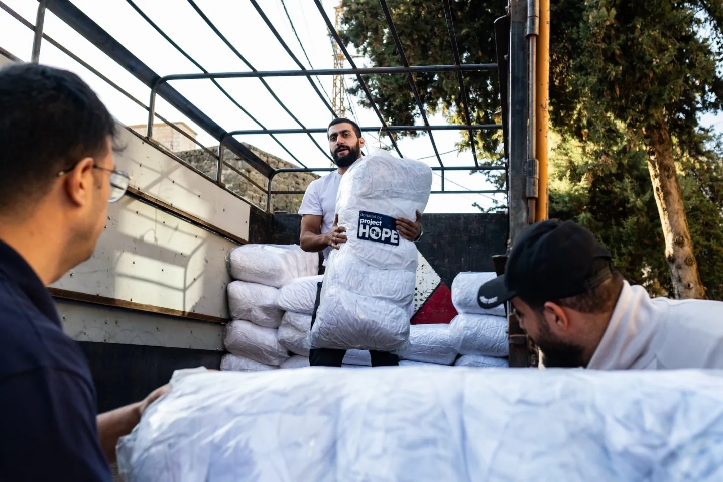 group of men distributing PPE in Lebanon