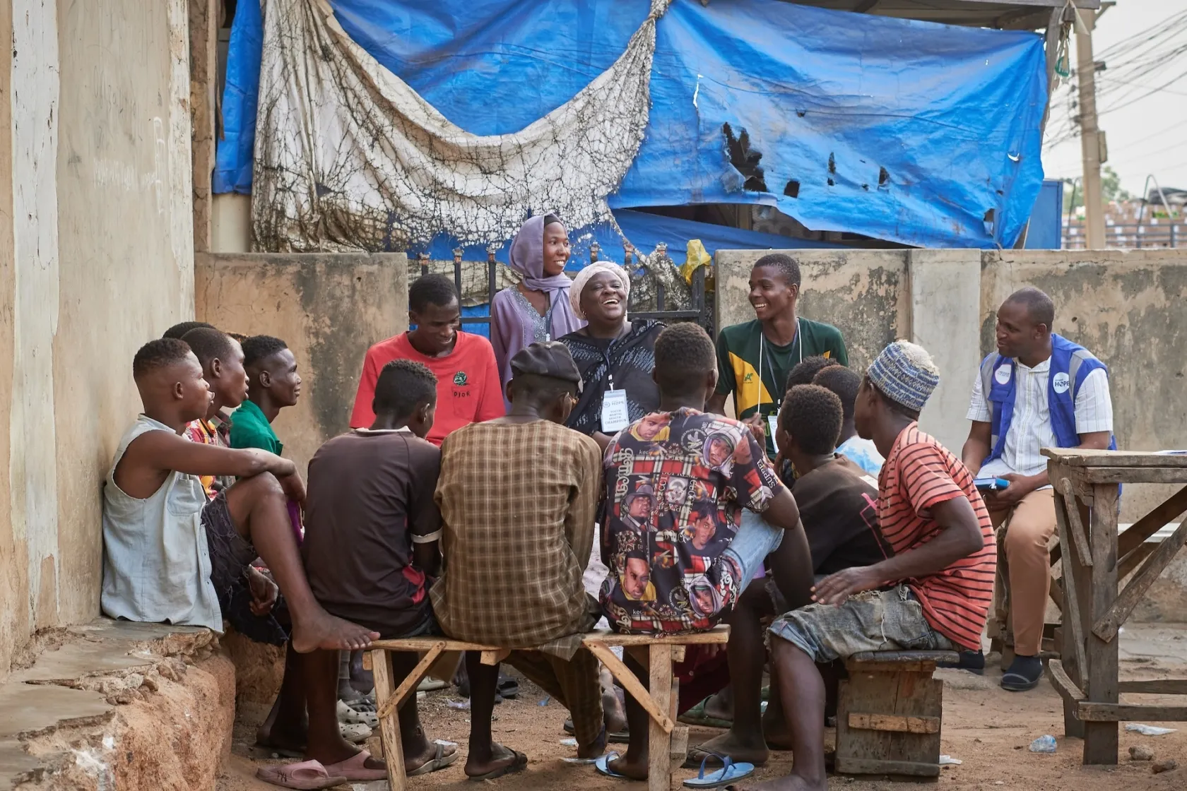 group of young men speaking together