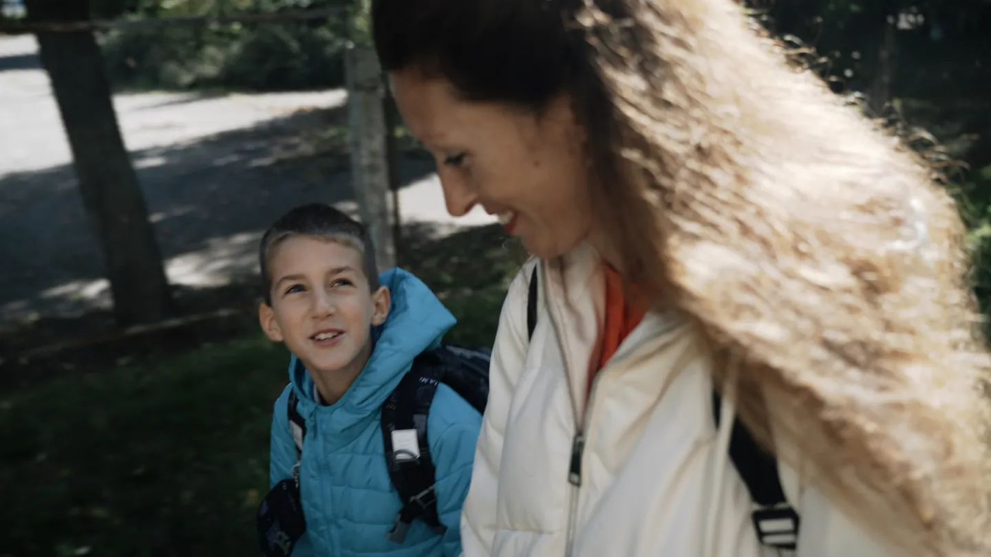 mother and young son walking together