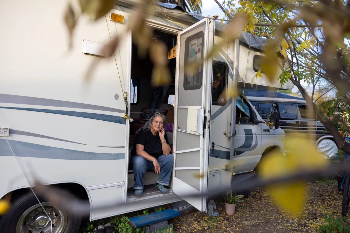 woman sitting in the doorway of