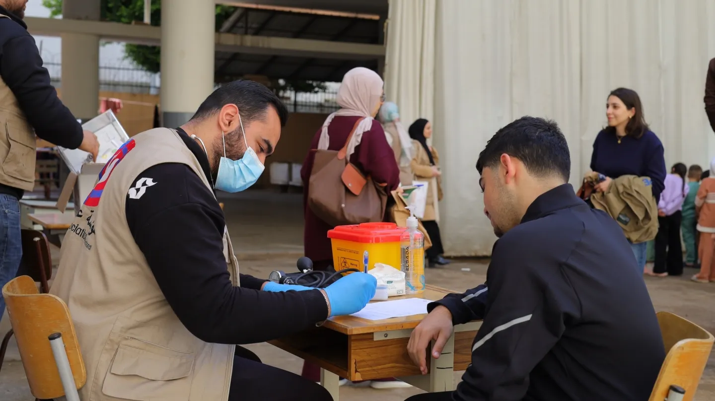 medical staff checks on patient in Lebanon