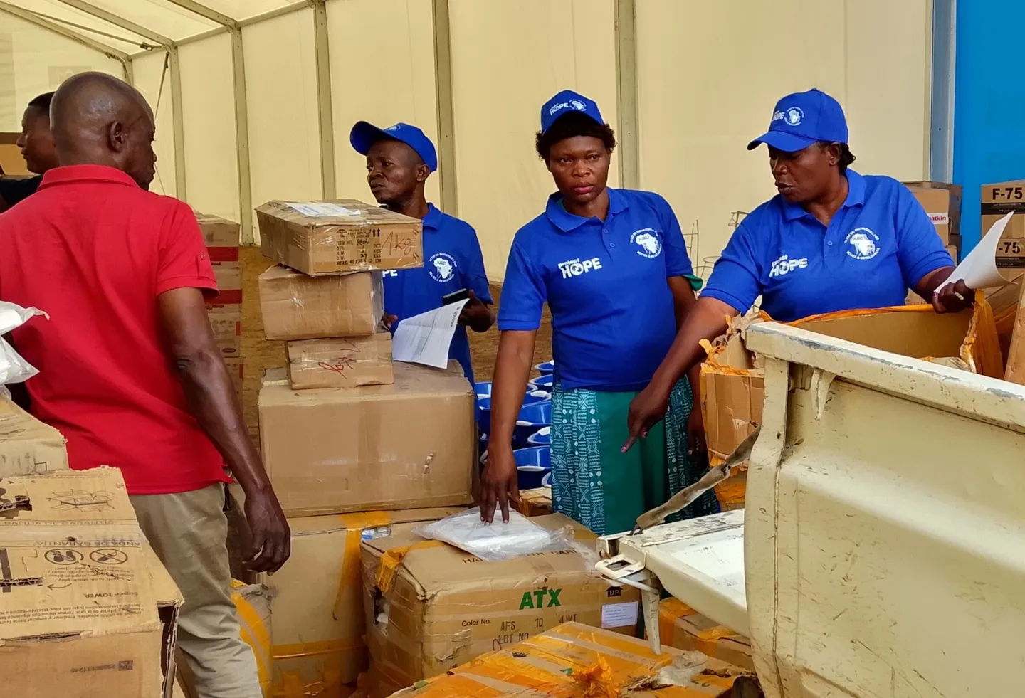 group of people sorting through supplies for Ebola in DRC