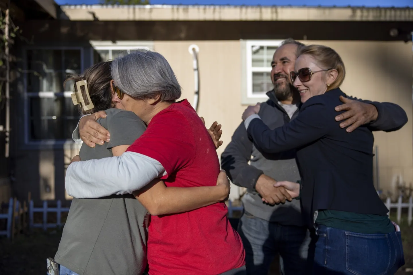 Two groups of two people hugging and embracing in North Carolina, USA