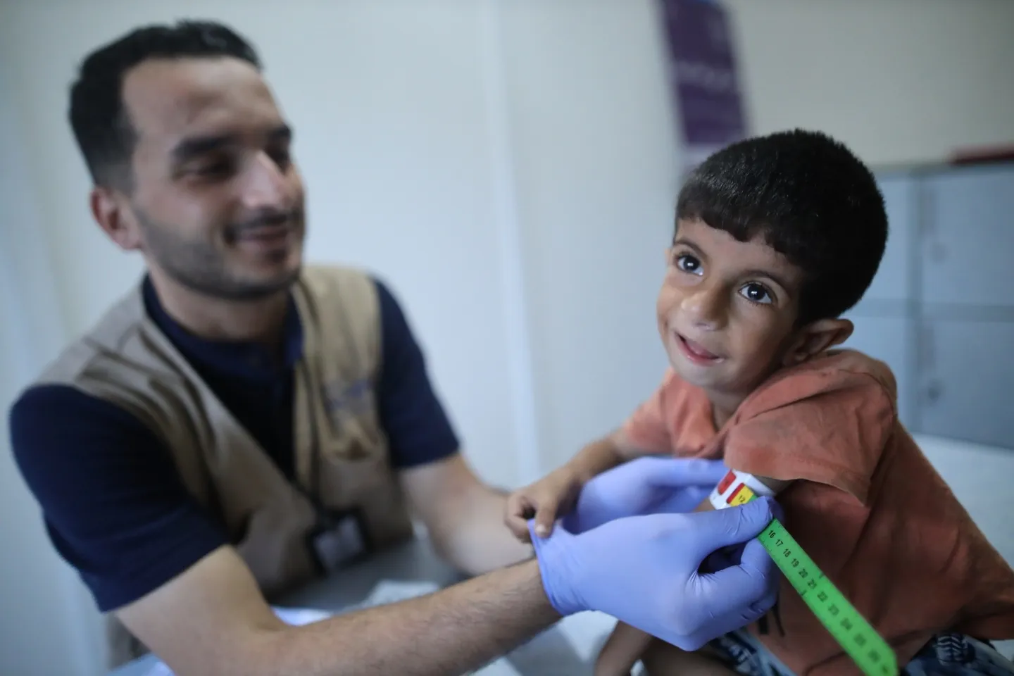 young boy getting checked on his nutrition levels in Gaza