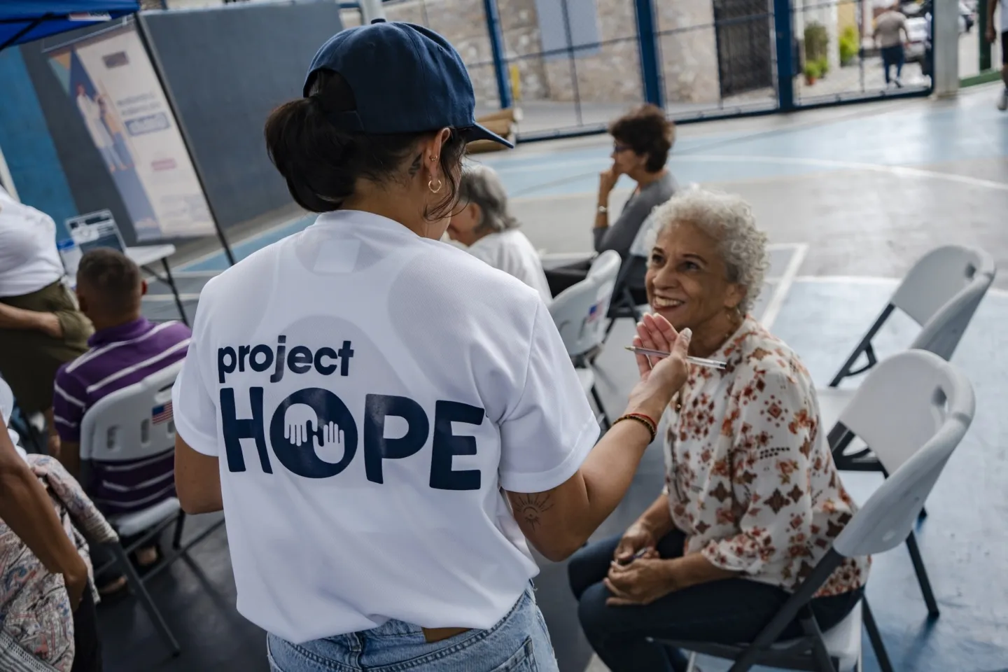 humanitarian worker speaks with patient in Venezuela